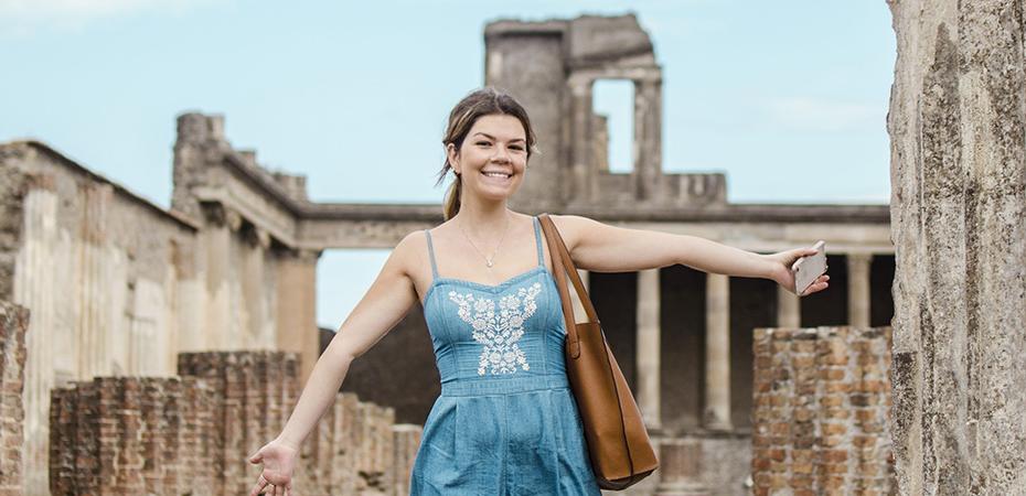 A study abroad student at the ruins of Pompei, Italy