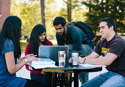 Students studying outside the Swan Business Center